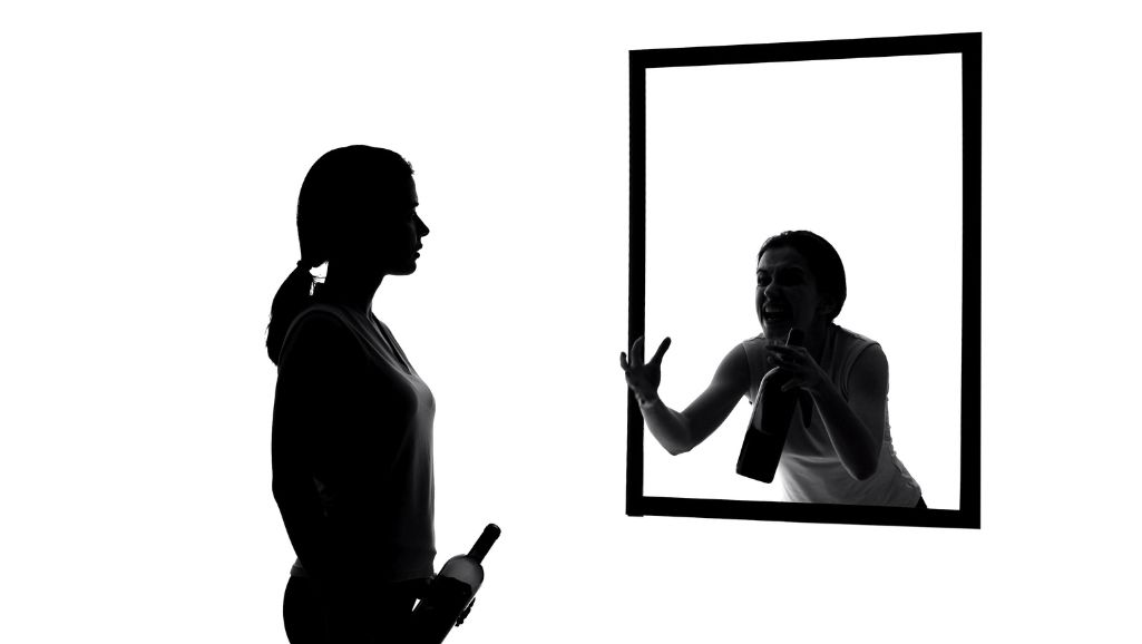 woman talking in mirror